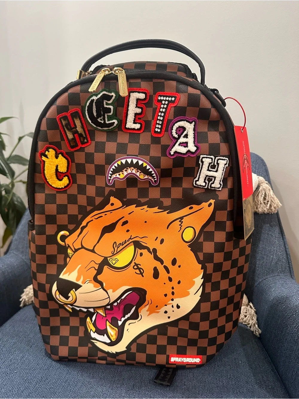 Sprayground Brown Checkerboard Backpack with Orange Tiger Patch